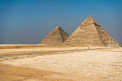 Egyptian pyramids on sky background