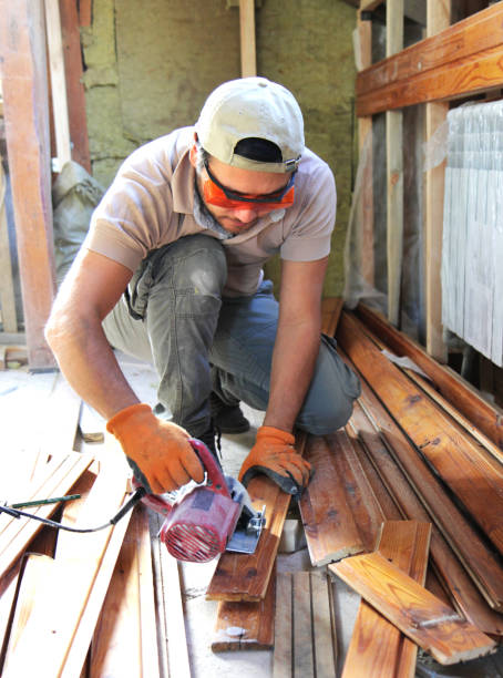 istock man building a house and workimg with wood 1030437424
