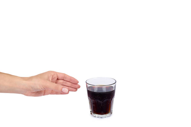 istock Cola drink in glass with hand isolated on white background, copy space template 1030439104