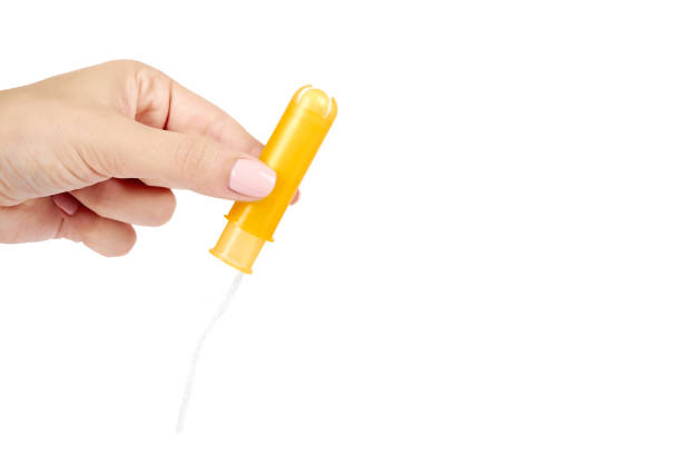 istock clean cotton tampon in case with hand isolated on white background, copy space template. 1030442018