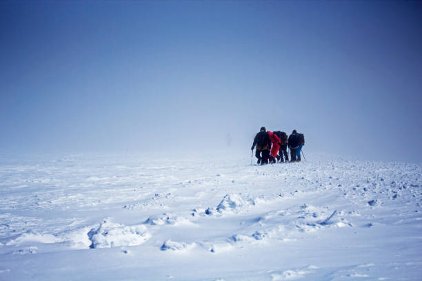 istock Group of tourists going up to Elbrus top 1030445788
