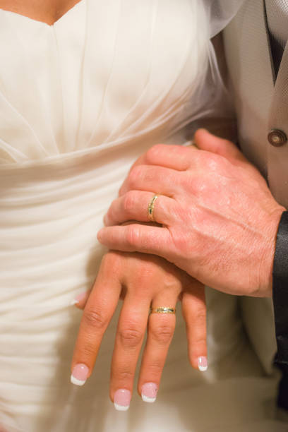 istock young spouses play with love rings that they have given themselves 1030451552
