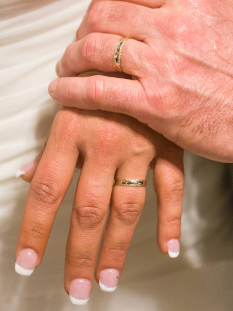 istock young spouses play with love rings that they have given themselves 1030451880