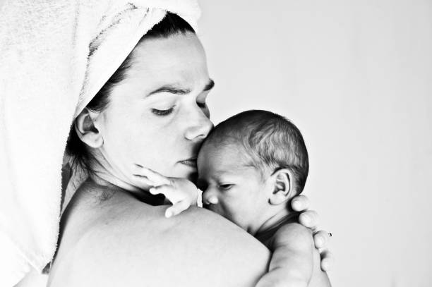 istock Maternal Bond - Mother And Child (New-Born Baby). Monochrome / Black And White 1030454320