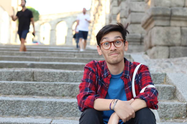 istock Young man with a funny expression outdoors 1030458414