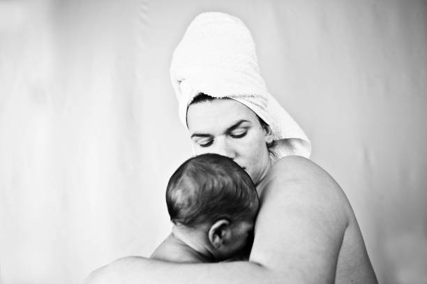 istock Maternal Bond - Mother And Child (New-Born Baby). Monochrome /Black & White 1030459474