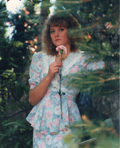 Blond teen girl outdoors stock photo