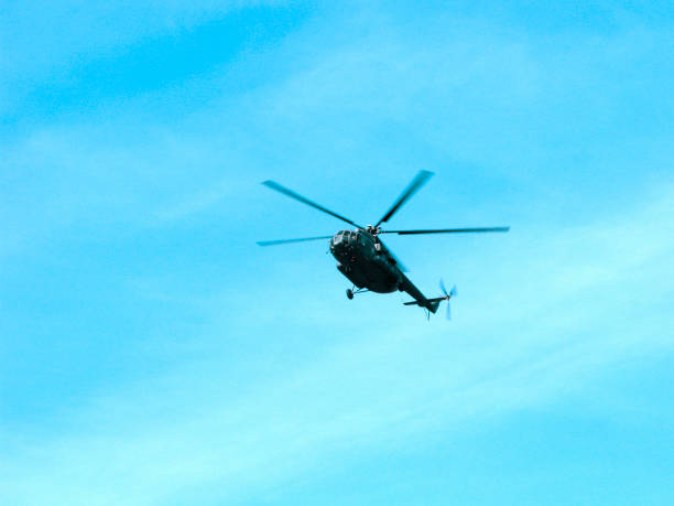istock Military helicopter in the sky 1030467854