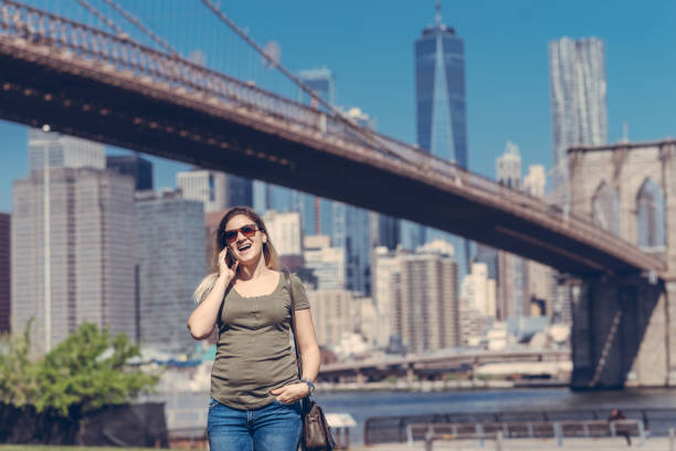 istock Woman using phone in New York 1030471022