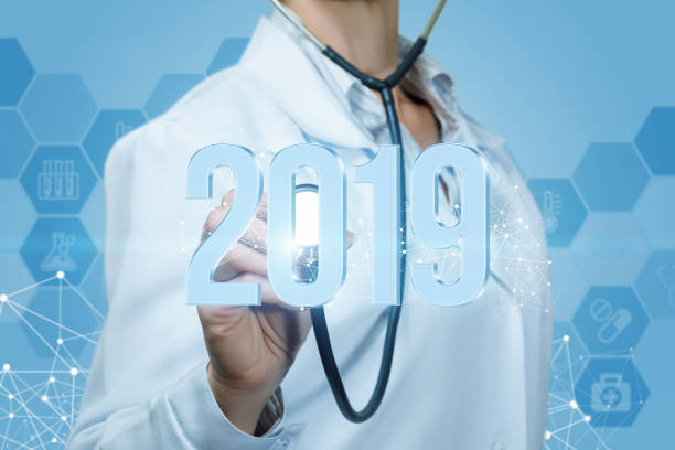 istock Doctor listens to 2019 figures on a blue background. 1030474396