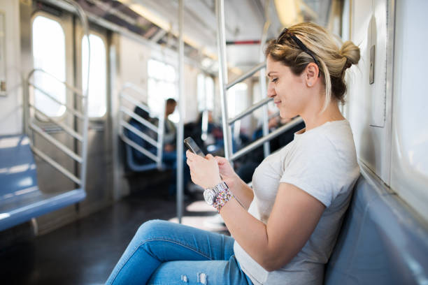 istock Woman using public transportation in New York City 1030474680