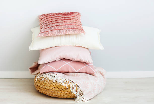 Pink and white pillows on the wall background Pink and white pillows on the wall background. Close up head board bed blue stock pictures, royalty-free photos & images