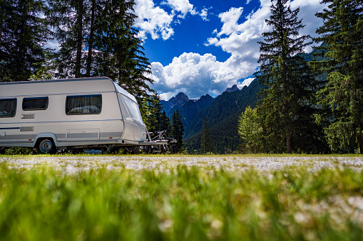 Family vacation travel, holiday trip in motorhome RV, Caravan car Vacation. Beautiful Nature Italy natural landscape Alps.