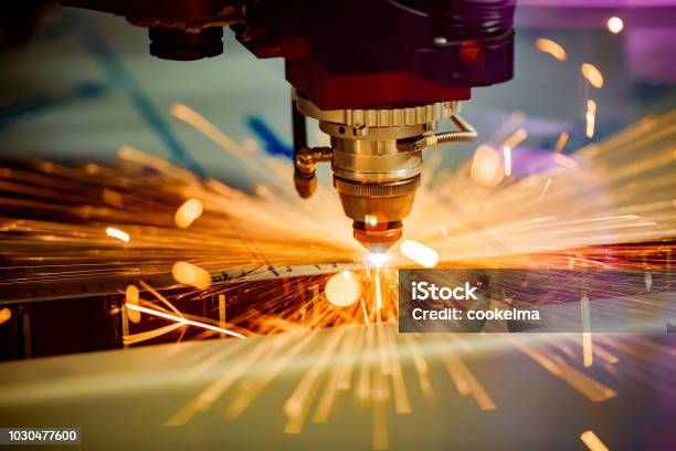 Cnc Laser Cutting Of Metal Modern Industrial Technology Stock Photo - Download Image Now