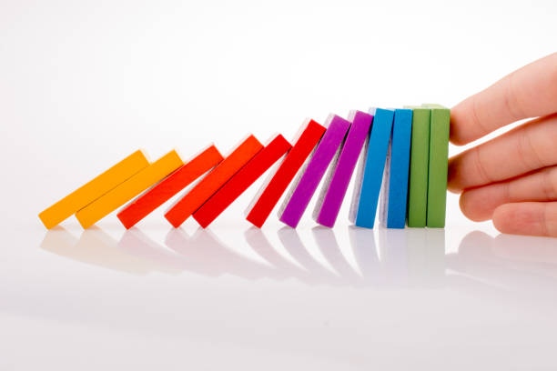 istock Hand holding color dominoes 1030478188