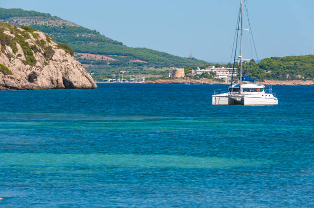istock catamaran moored in a cove 1030495932