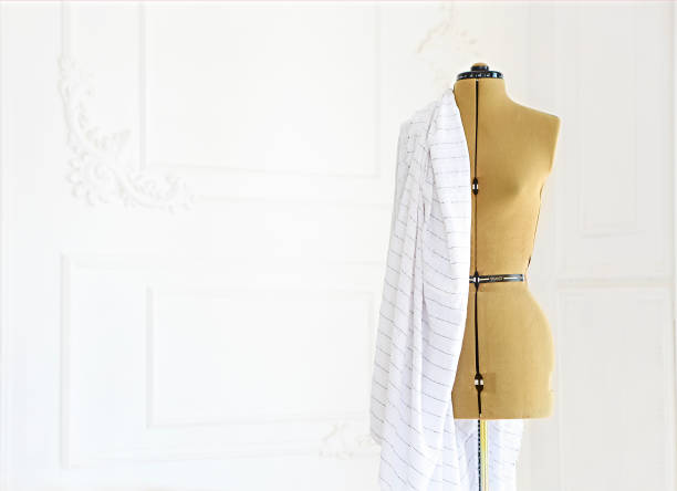 istock Mannequin with cloth in the white room 1030499448