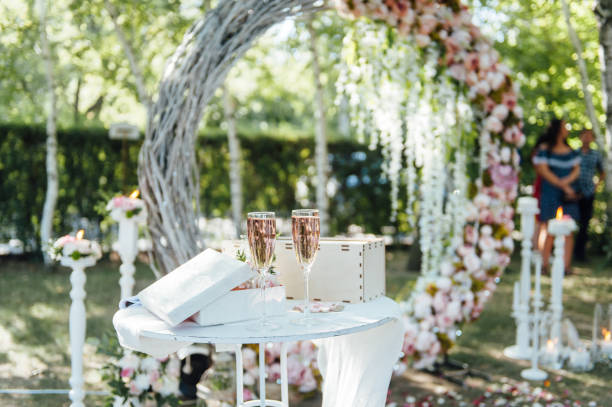 istock wedding arch and chairs on the grass in the park. 1030500306