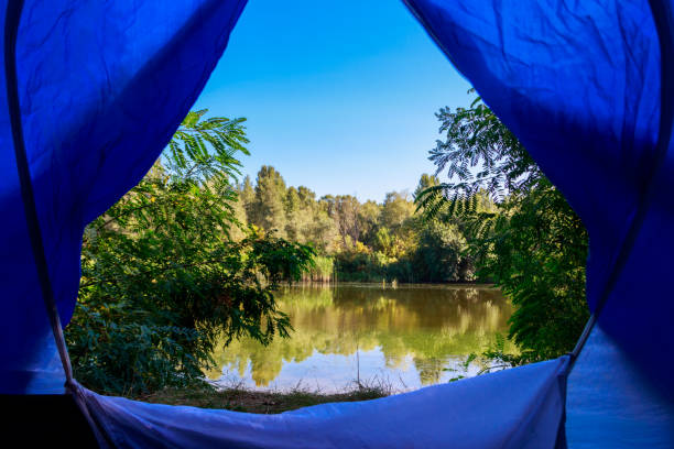 istock View on the lake from inside of a tent 1030503234