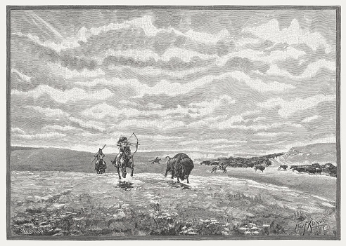 North American Indians hunt buffalo in the prairie. Wood engraving after a drawing by Max Fancis Klepper (German-American illustrator, 1861 - 1907), published in 1888.