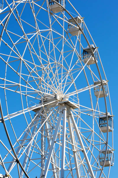 istock Ferris Wheel on a blue sky background 1030507326