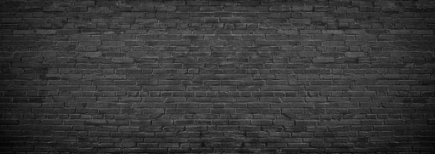 istock black brick wall of panoramic view in high resolution 1030509502