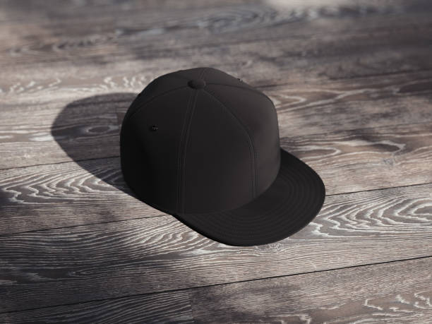istock Black realistic cap isolated on dark wooden background, 3d rendering 1030509918