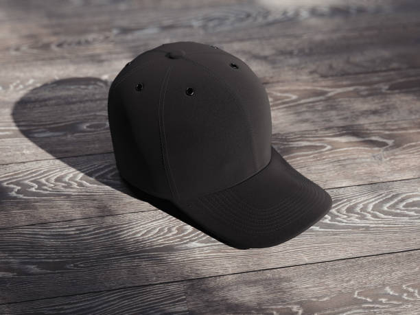 istock Black realistic cap isolated on wooden background, 3d rendering 1030509948