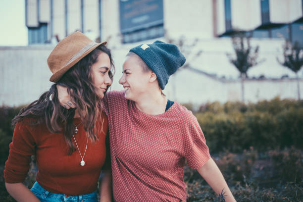 istock Lesbian couple laughing face to face 1030510088
