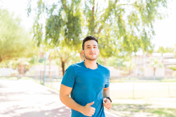 istock Ambitious Runner Working Out In Park During Summer 1030513742