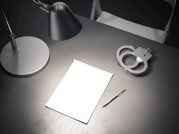 Close up of grey table with switched-on lamp, handcuffs and paper sheet above in dark interrogation room, 3d rendering.