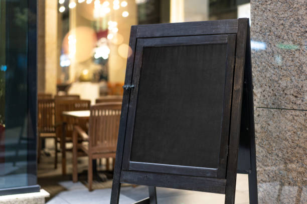 istock Close up of black sandwich board next to restaurant. 1030515200