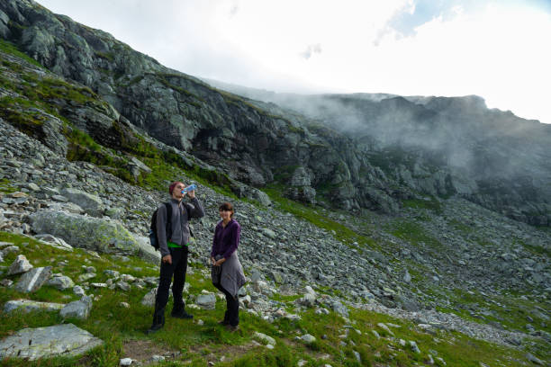 istock Young couple of hikers 1030521932