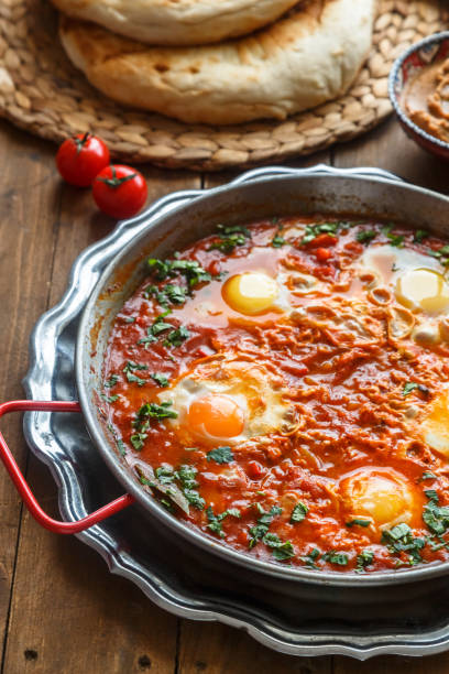 istock Big shakshuka in iron pan, close view. 1030525406