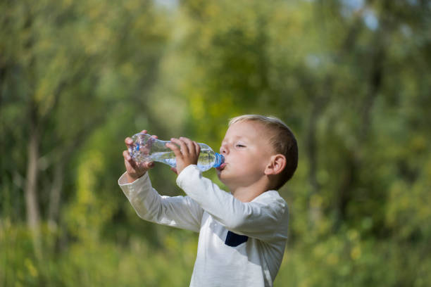 istock A small boy with a bottle of still water 1030529824