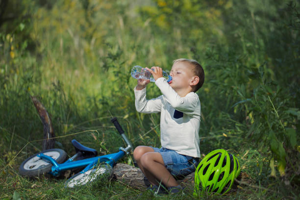 istock A small boy with a bottle of still water 1030529940