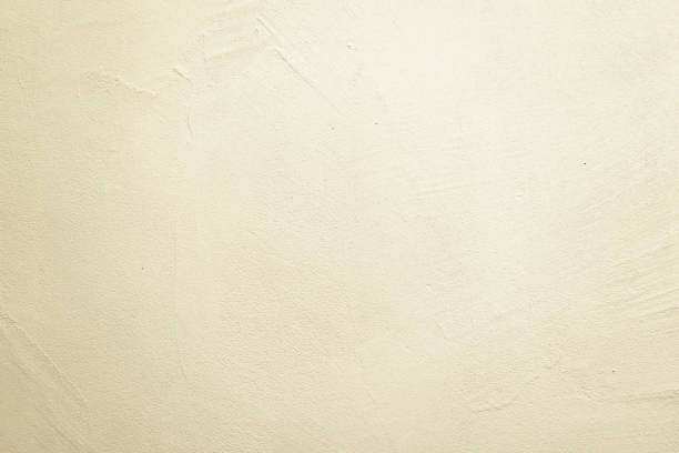 istock Grungy white concrete wall background. Cracked plaster white. 1030530554