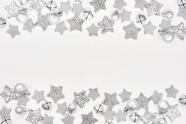 istock Christmas greeting card. Christmas silver decoration on white background. Top view, copy space 1030531134
