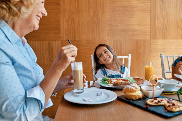 istock cheerful breakfast with grandmother 1030534454