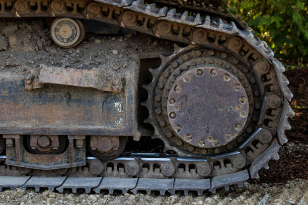 istock Industrial implement steel metal wheel tracks 1030543804