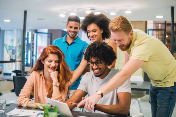 istock Young people gathered around digital tablet 1030544148