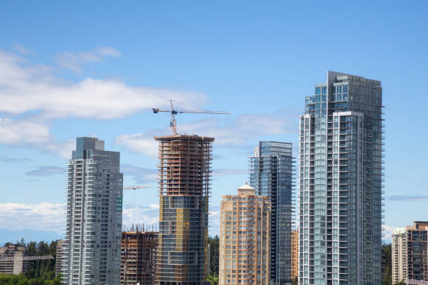 Aerial view of Commercial buildings by Metropolis Shopping Mall during a vibrant summer day. Taken in Metrotown, Burnaby, Vancouver, BC, Canada.
