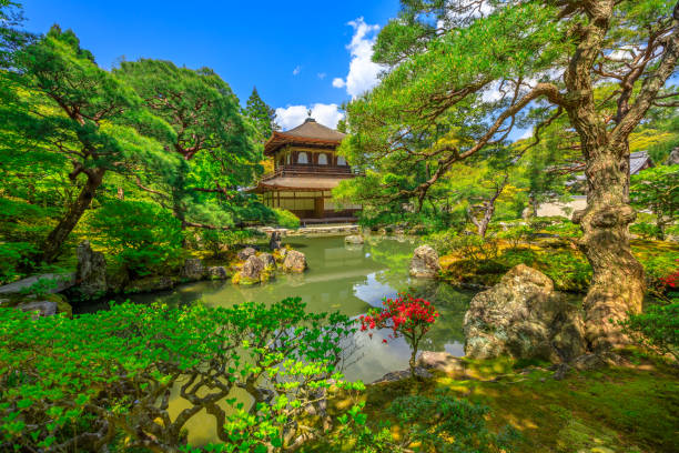 Kyoto, Japan - April 28, 2017: Scenic landscape of pond in springtime and architecture of Kannon-Hall in Ginkakuji Temple. Ginkaku-ji or Silver Pavilion, officially Jisho-ji, is a Zen temple in Higashiyama District, Kyoto, Japan.