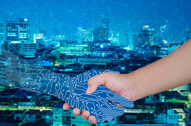 istock Digital Composite Image Of Circuit Board Shaking Hands With Person Against Illuminated Cityscape At Night 1030563234