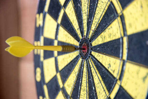 istock Dartboard with dart in bulls eye 1030564020