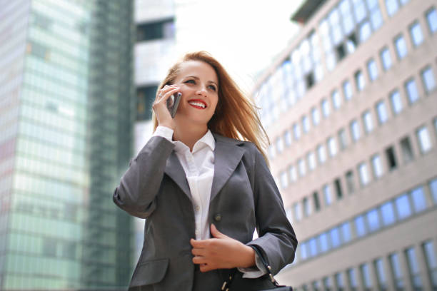 upper business class woman on the phone - upper class women wealth fashion model imagens e fotografias de stock