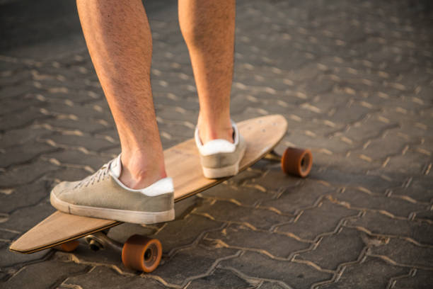 istock longboarding, on the road, brick road, ride 1030568220