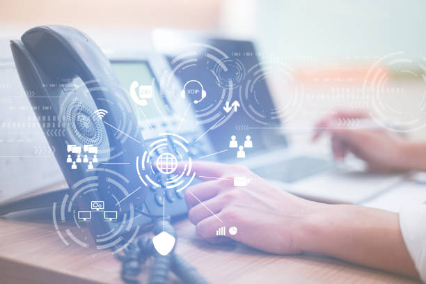 istock close up man hand point to press button number on telephone office desk with virtual interface effect of telecommunication.hotline employee concept 1030580074