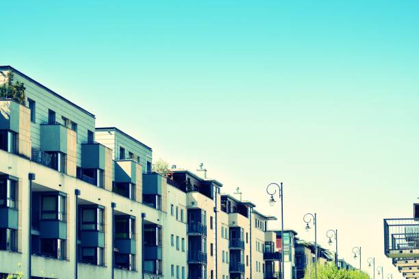 istock Modern apartment building exterior. Retro colors stylization 1030580892