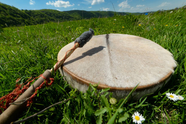 istock Shamanic tambourine on a meadow 1030584098